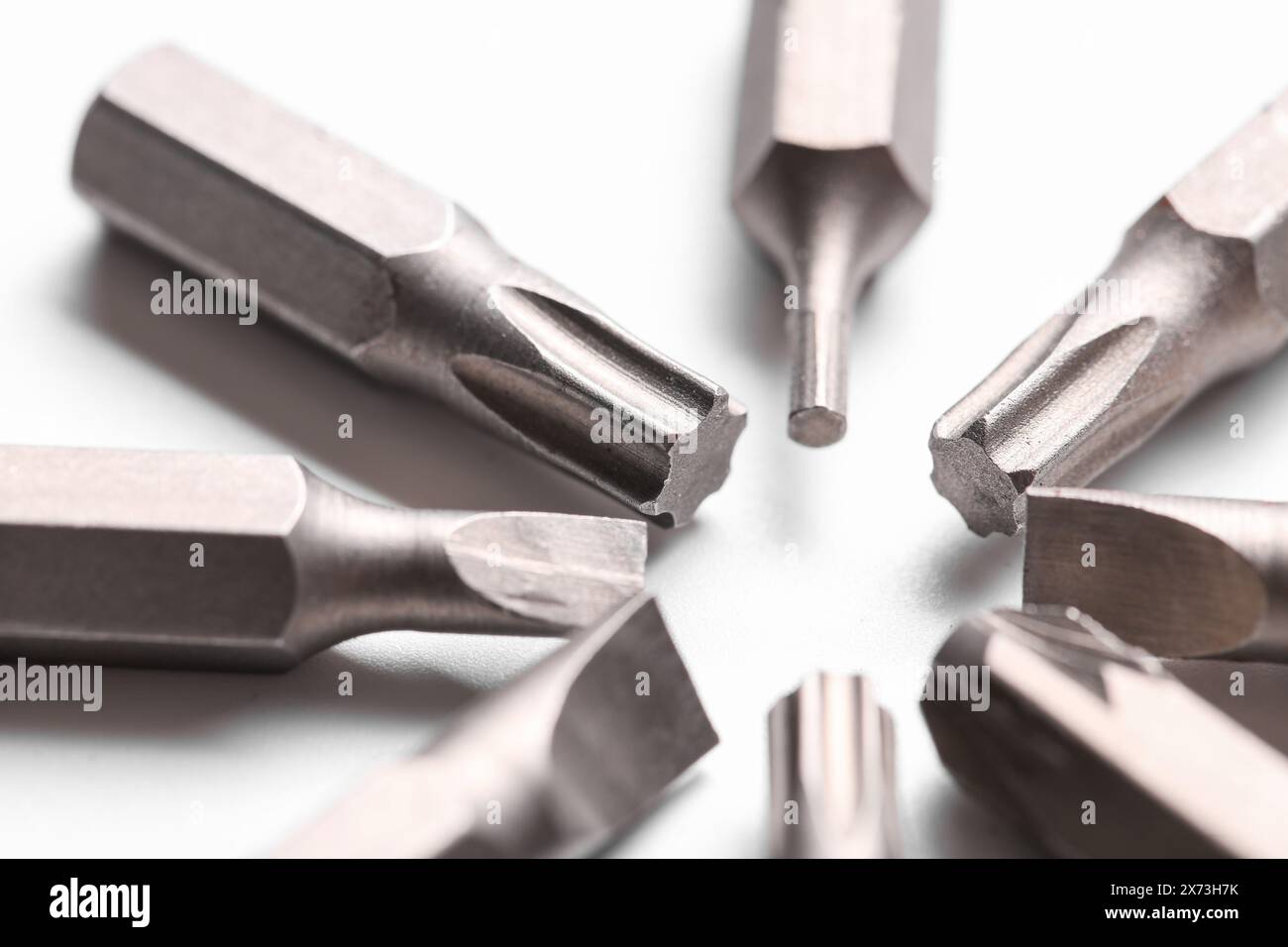 Different screwdriver bits on white background, closeup Stock Photo
