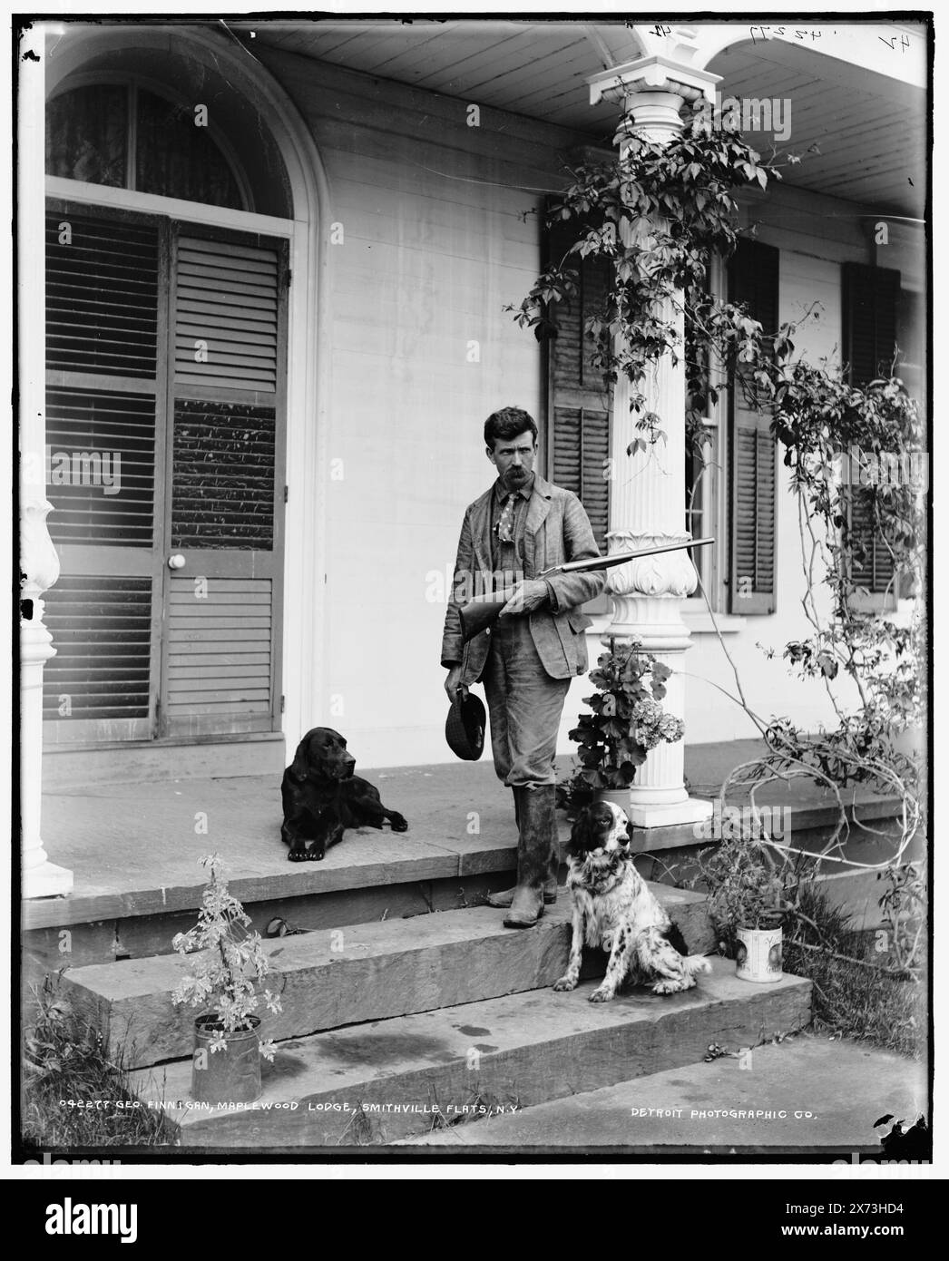 George Finnigan, Maplewood Lodge, Smithville Flats, N.Y., Date from jacket., Negative broken., '42' on negative., Detroit Publishing Co. no. 042277., Gift; State Historical Society of Colorado; 1949,  Porches. , Hotels. , Hunting dogs. , United States, New York (State), Smithville Flats. Stock Photo