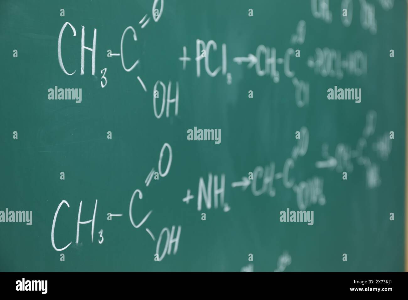 Chemical formulas written with chalk on green board Stock Photo Alamy