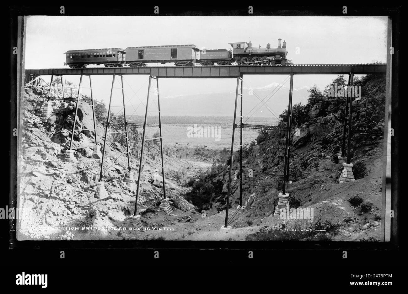 High bridge near Buena Vista, On train: Colorado Midland., 'W.H. Jackson & Co. Phot.' on negative., Detroit Publishing Co. no. 60148., Gift; State Historical Society of Colorado; 1949,  Railroad bridges. , Railroads. , Canyons. , United States, Colorado, Buena Vista. Stock Photo