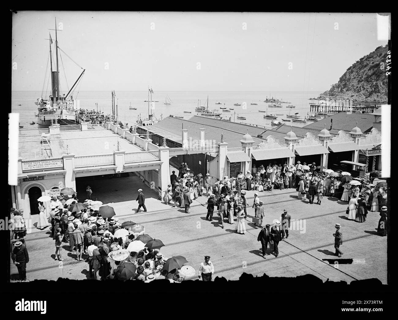 Steamship ticket office at pier, Avalon, Catalina Island, Calif., Title devised by cataloger., '4508' on negative., Detroit Publishing Co. no. 068148., Gift; State Historical Society of Colorado; 1949,  Passengers. , Harbors. , Piers & wharves. , United States, California, Santa Catalina Island. , United States, California, Avalon. Stock Photo