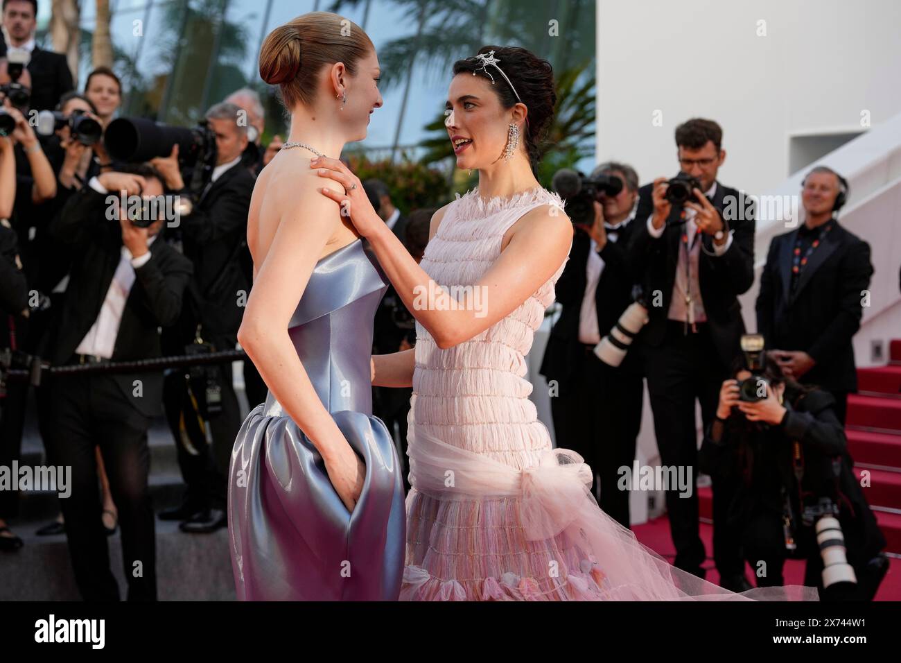 hunter-schafer-left-and-margaret-qualley-pose-for-photographers-upon