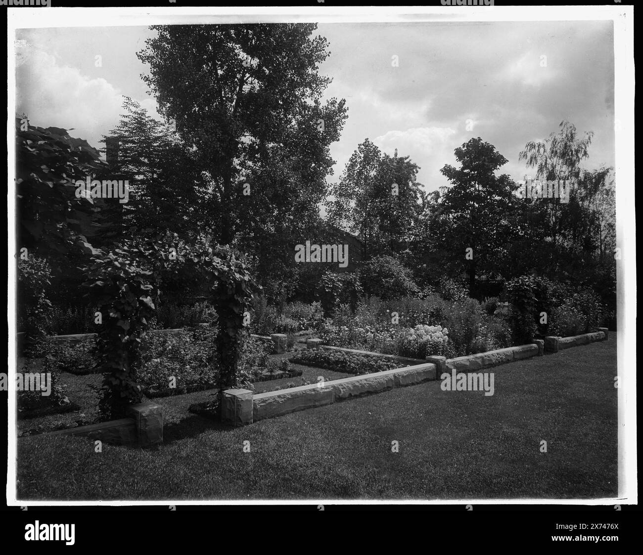 Garden and arbor, residence of Mrs. Franklin H. Walker, Detroit, Mich., Title based on negative D4-43702., Detroit Publishing Co. no. 4 X., Gift; State Historical Society of Colorado; 1949,  Gardens. , United States, Michigan, Detroit. Stock Photo