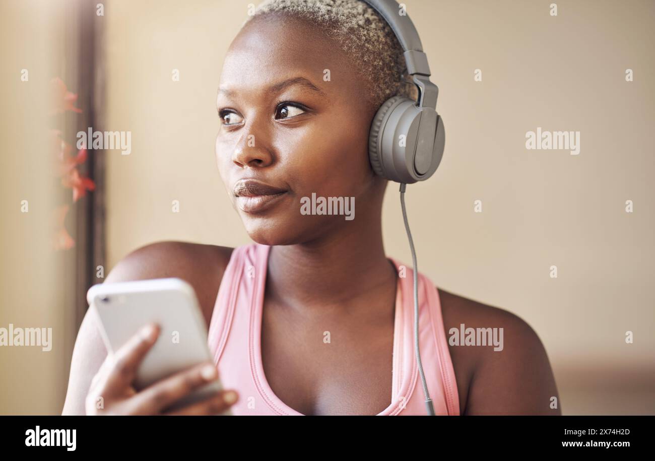 Black woman, thinking and headphones for music, streaming and listening ...
