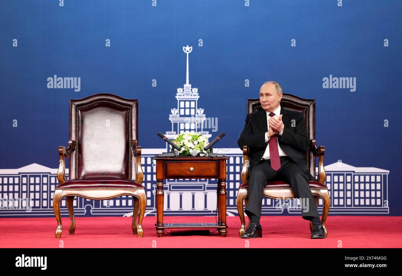Harbin, China. 17th May, 2024. Russian President Vladimir Putin, applauds the introduction by HIT Chairman Xiong Sihao during a visit with faculty and students at the Harbin Institute of Technology, May 17, 2024, in Harbin, China. The university was founded in 1920 as Harbin Sino-Russia Industrial School. Credit: Kremlin Pool/Russian Presential Press Service/Alamy Live News Stock Photo