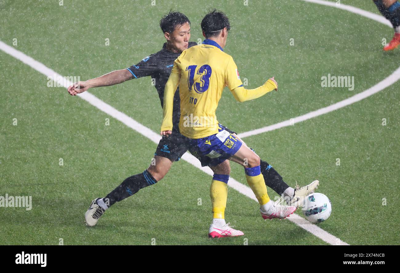 OHL's Takahiro Akimoto and STVV's Ryotaro Ito fight for the ball during