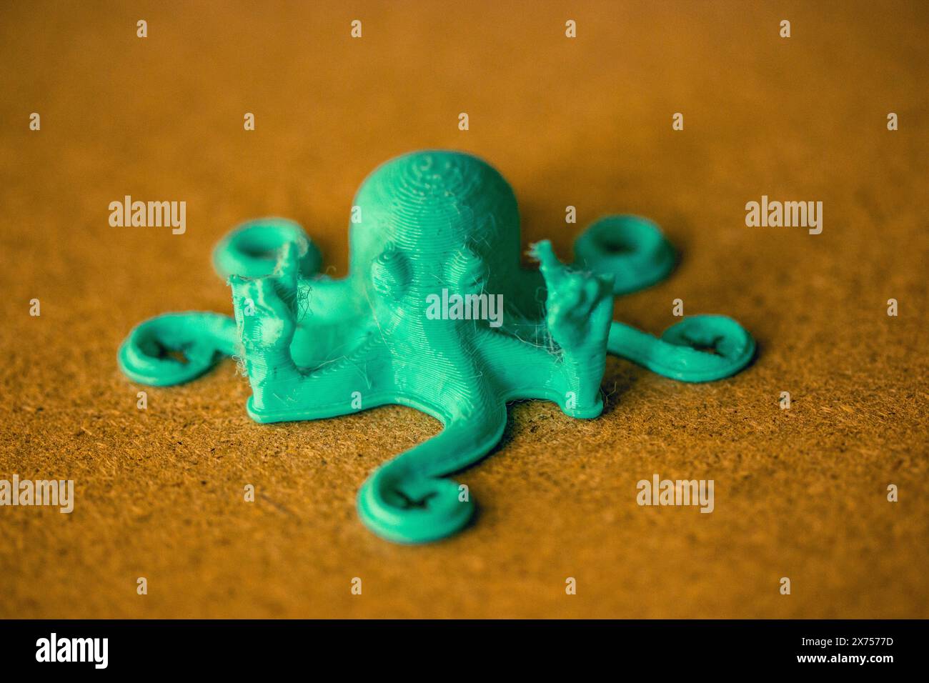 Toy green octopus with tentacles created from recycled plastic. DIY toy character of an underwater world inhabitant. Sea, ocean animal creature. Stock Photo