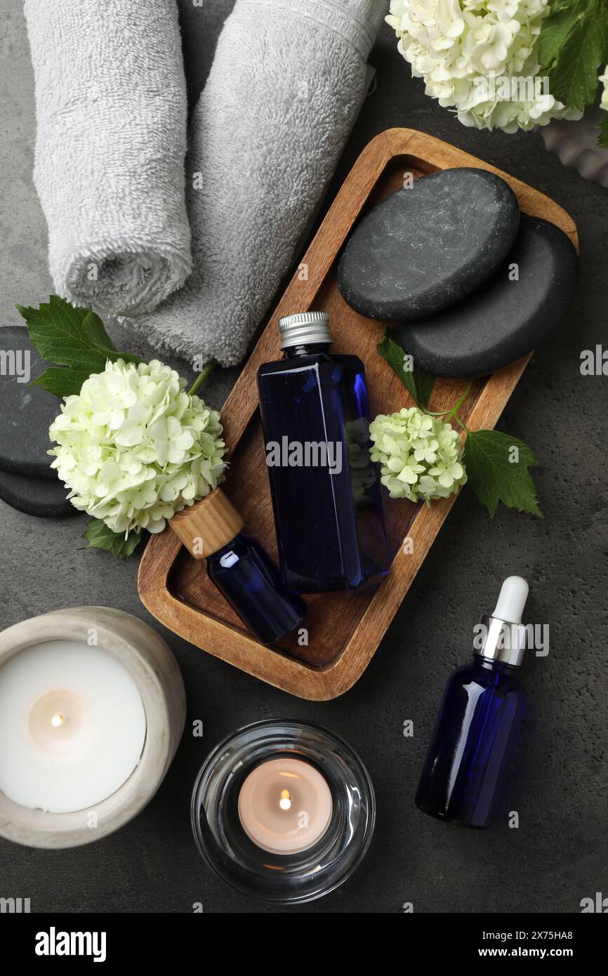 Flat lay composition with spa products on gray table Stock Photo - Alamy