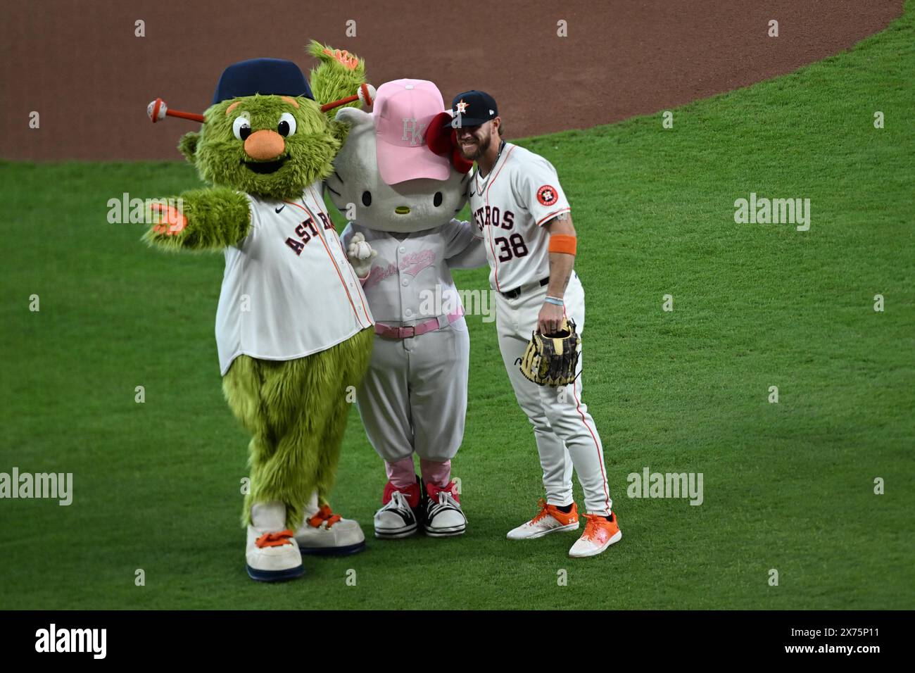 Mascots Orbit and Hello Kitty pose with Houston Astros outfielder Trey Cabbage (38) before the MLB baseball game between the Oakland AÕs and the Houst Stock Photo