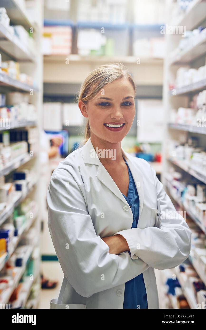 Intern, pharmacy or portrait of happy woman with arms crossed or pharmacist in healthcare clinic or drugstore. Trust, smile or proud medical worker by Stock Photo
