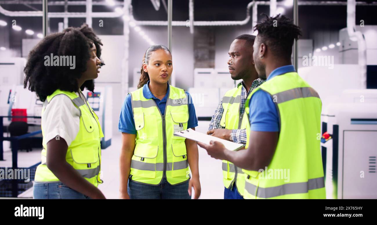 Factory Engineers Meeting. Checking Industrial Facility. Modern Factory Stock Photo