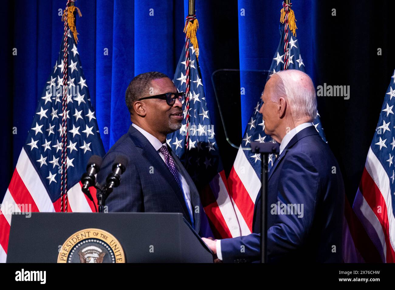Washington, USA. 17th May, 2024. Derrick Johnson, president of the NAACP, greets US President Joe Biden at the National Museum of African American History and Culture in Washington, DC, US, on Friday, May 17, 2024. Black voters have long been a reliable mainstay of the Democratic Party, but Donald Trump, the former president and current Republican nominee, is garnering 22% support from Black voters in battleground states including Georgia. Photographer: Al Drago/Pool/Sipa USA Credit: Sipa USA/Alamy Live News Stock Photo