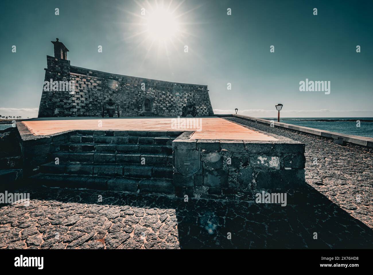 Wide angle view of Castillo de San Jose in Arrecife, sun rays, blue sky, Lanzarote, Canary Islands, Spain Stock Photo