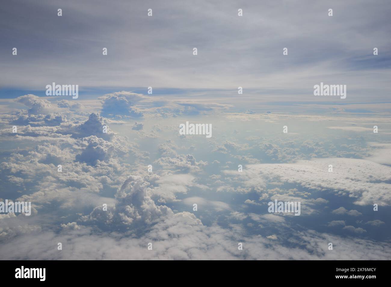 Aerial view seen over clouds from aircraft Stock Photo - Alamy