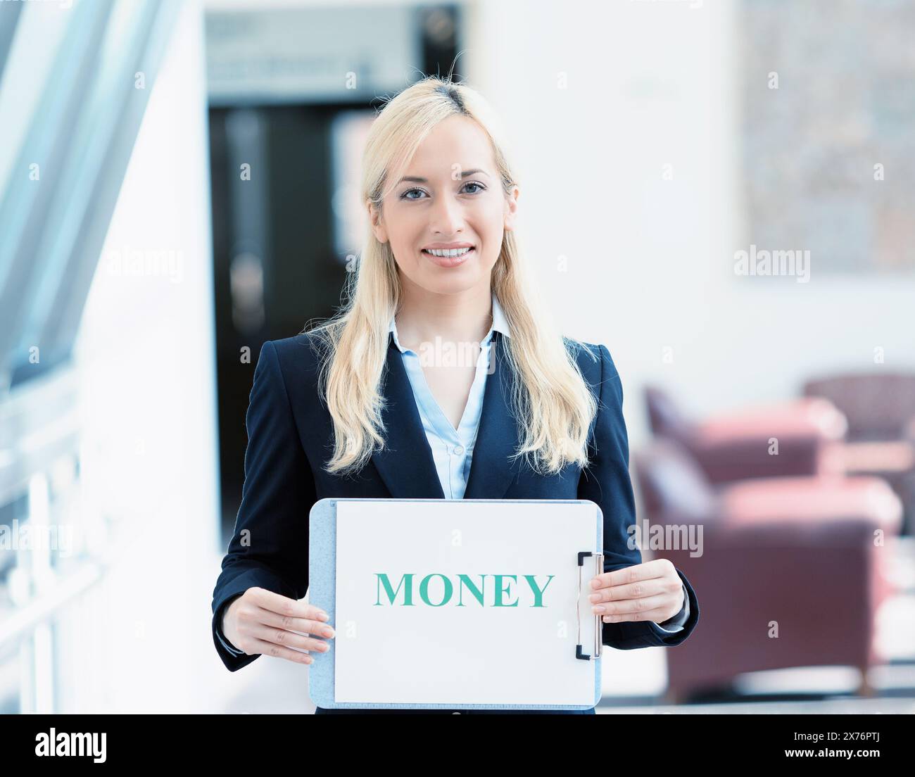 Portrait of a smiling businesswoman with money sign Stock Photo - Alamy