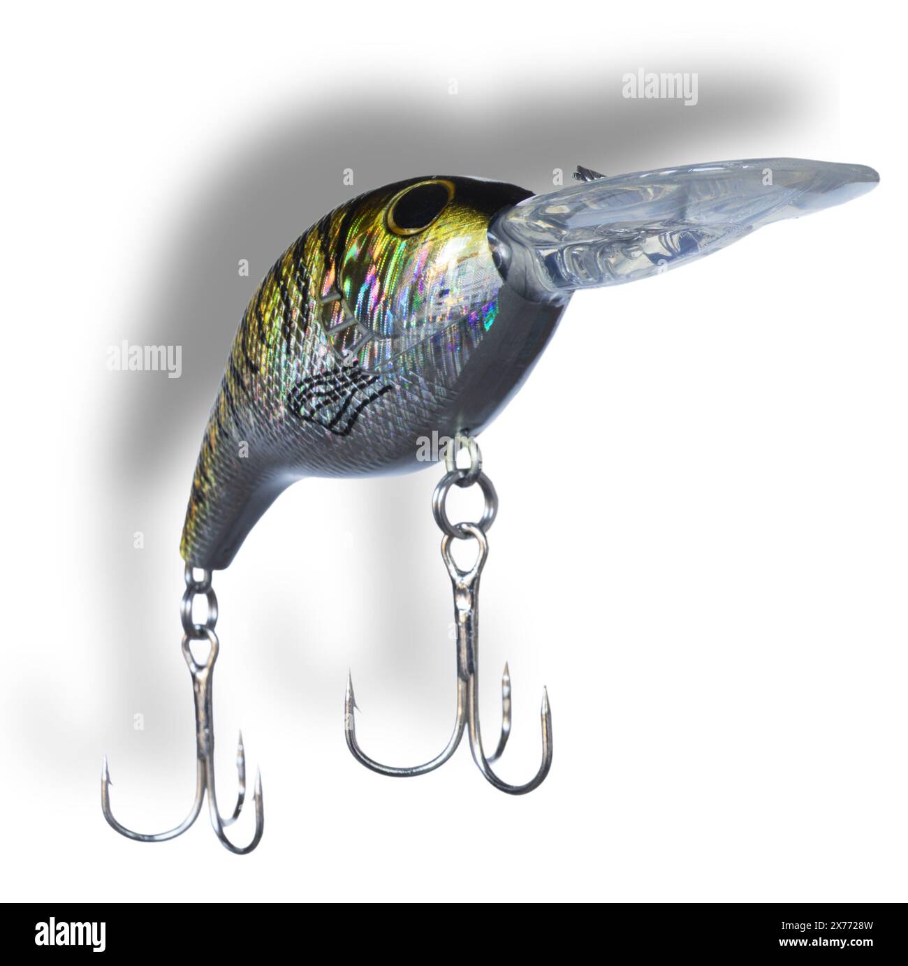 Drop shadow behind a gold and silver with black striped artificial fishing bait wearing two treble hooks and a bill up front for it to run deep after Stock Photo