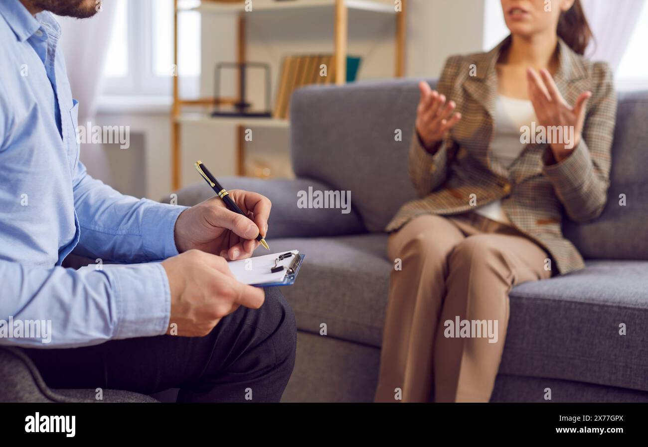 Psychiatrist, psychiatric doctor session for psychosocial support, help, writing form, talking Stock Photo