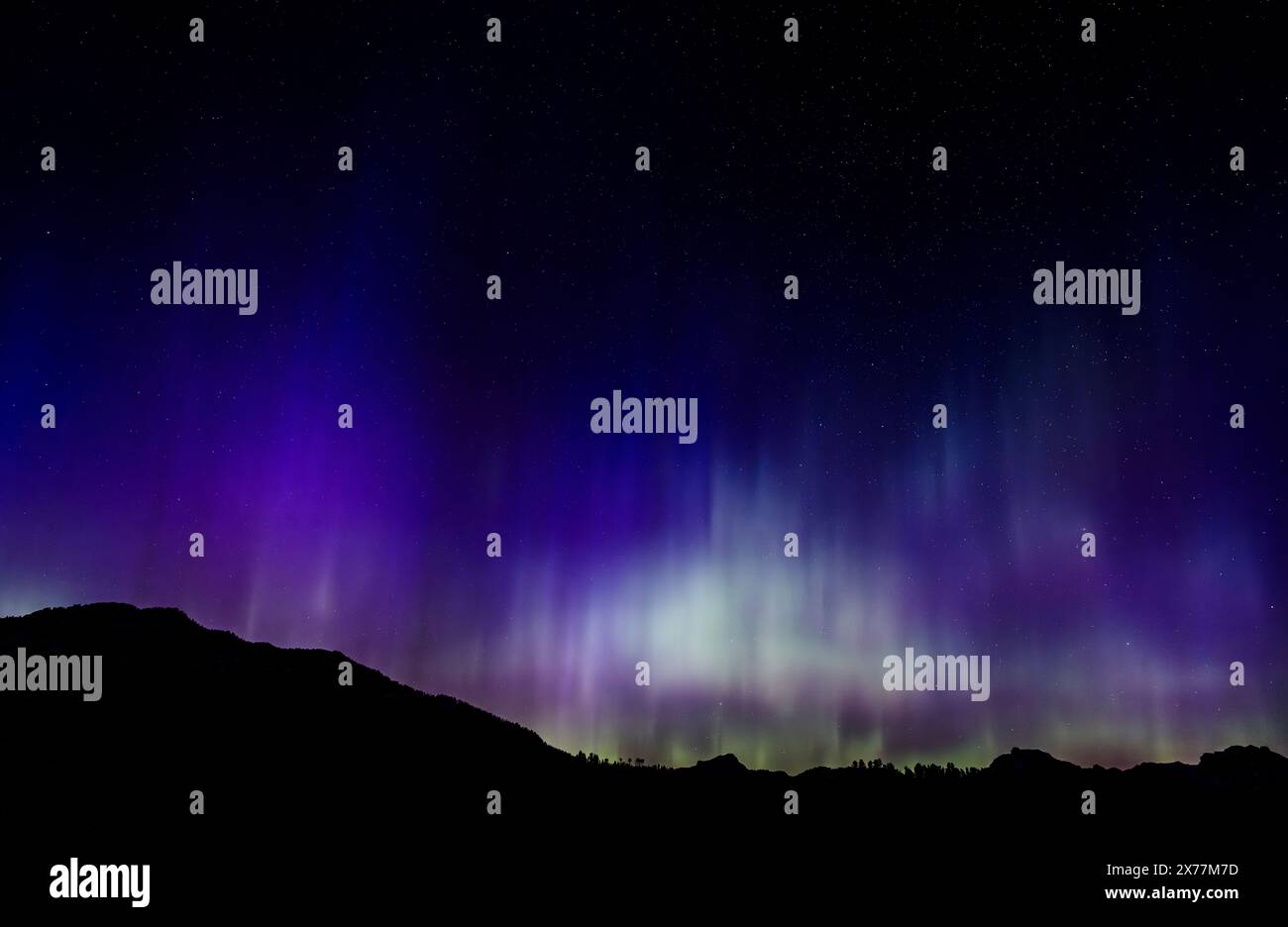 Aurora Borealis early in the morning of May 11, 2024, seen over the Lamar Valley in Yellowstone National Park. Stock Photo