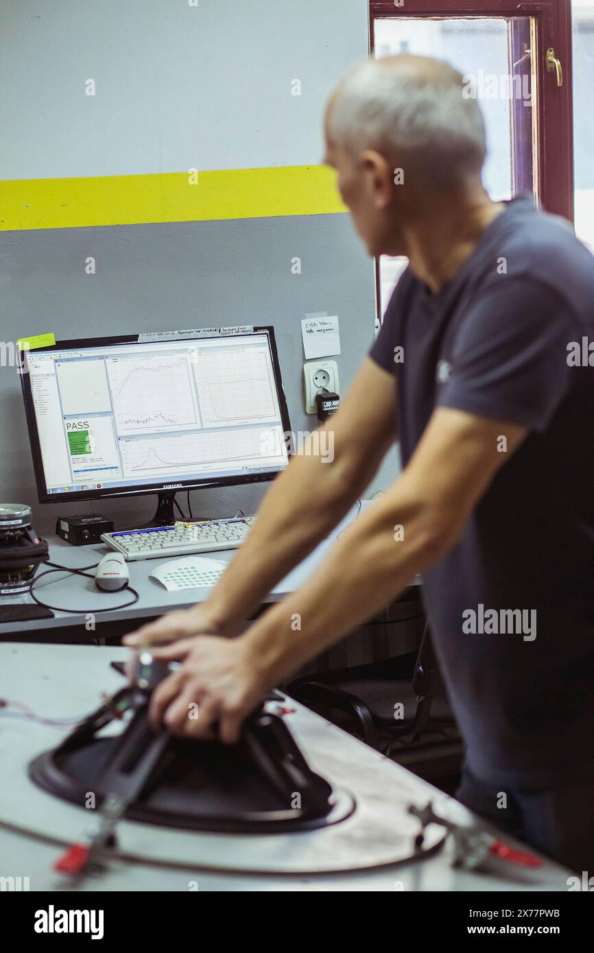 Bila Tserkva, Ukraine, March 9, 2021: worker testing audio speaker  Stock Photo