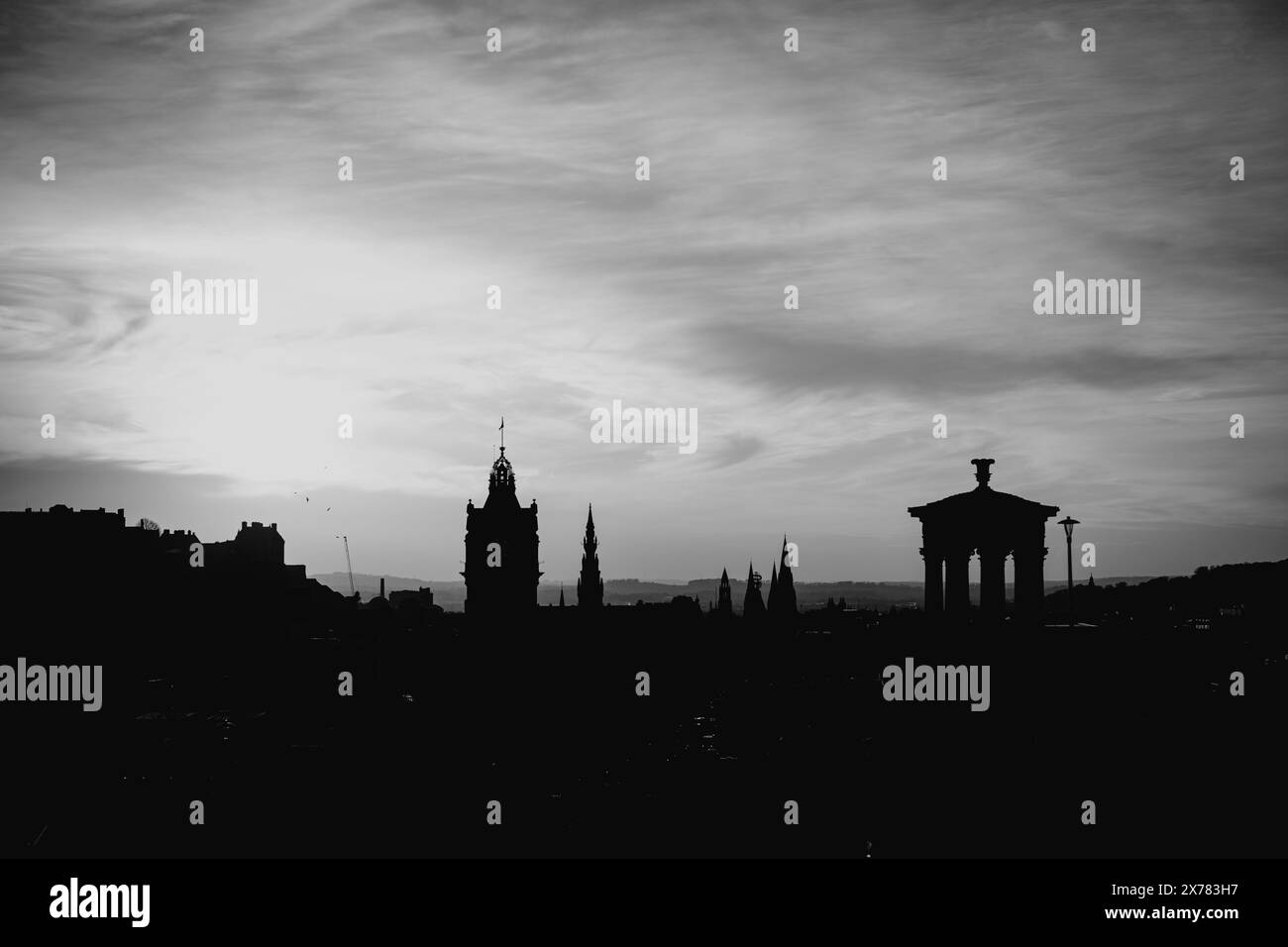 Edinburgh Scotland: 13th Feb 2024: Carlton Hill lookout point at sunset. Edinburgh city skyline silhouette black and white Stock Photo