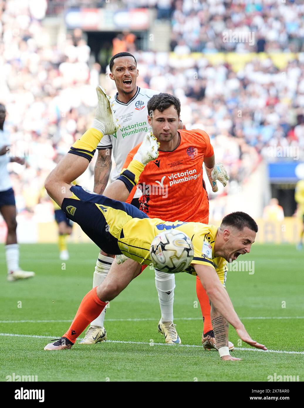 Oxford United's Owen Dale collides with Bolton Wanderers goalkeeper