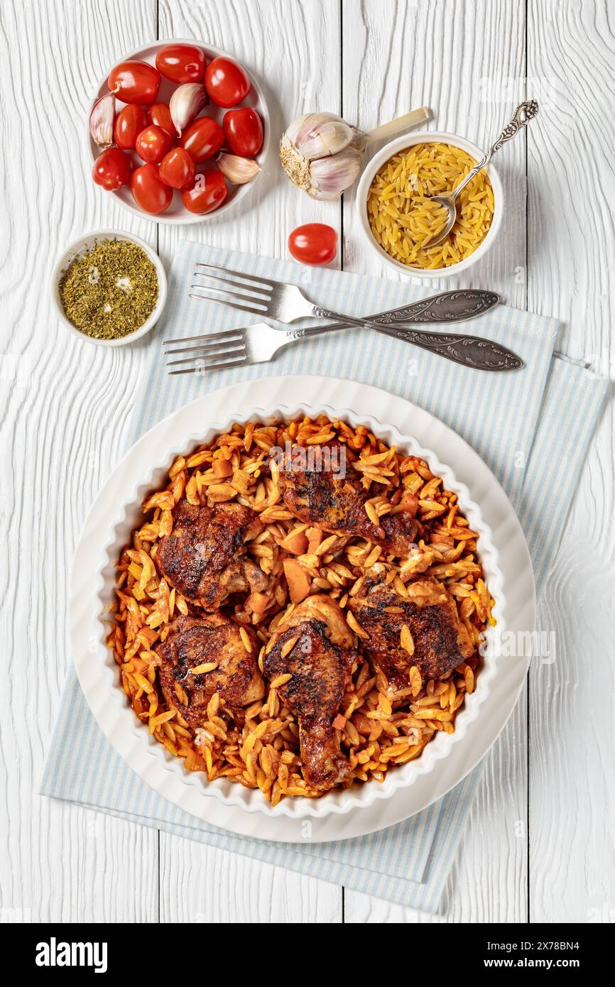 Greek chicken orzo stew in tomato based sauce, giouvetsi youvetsi in
