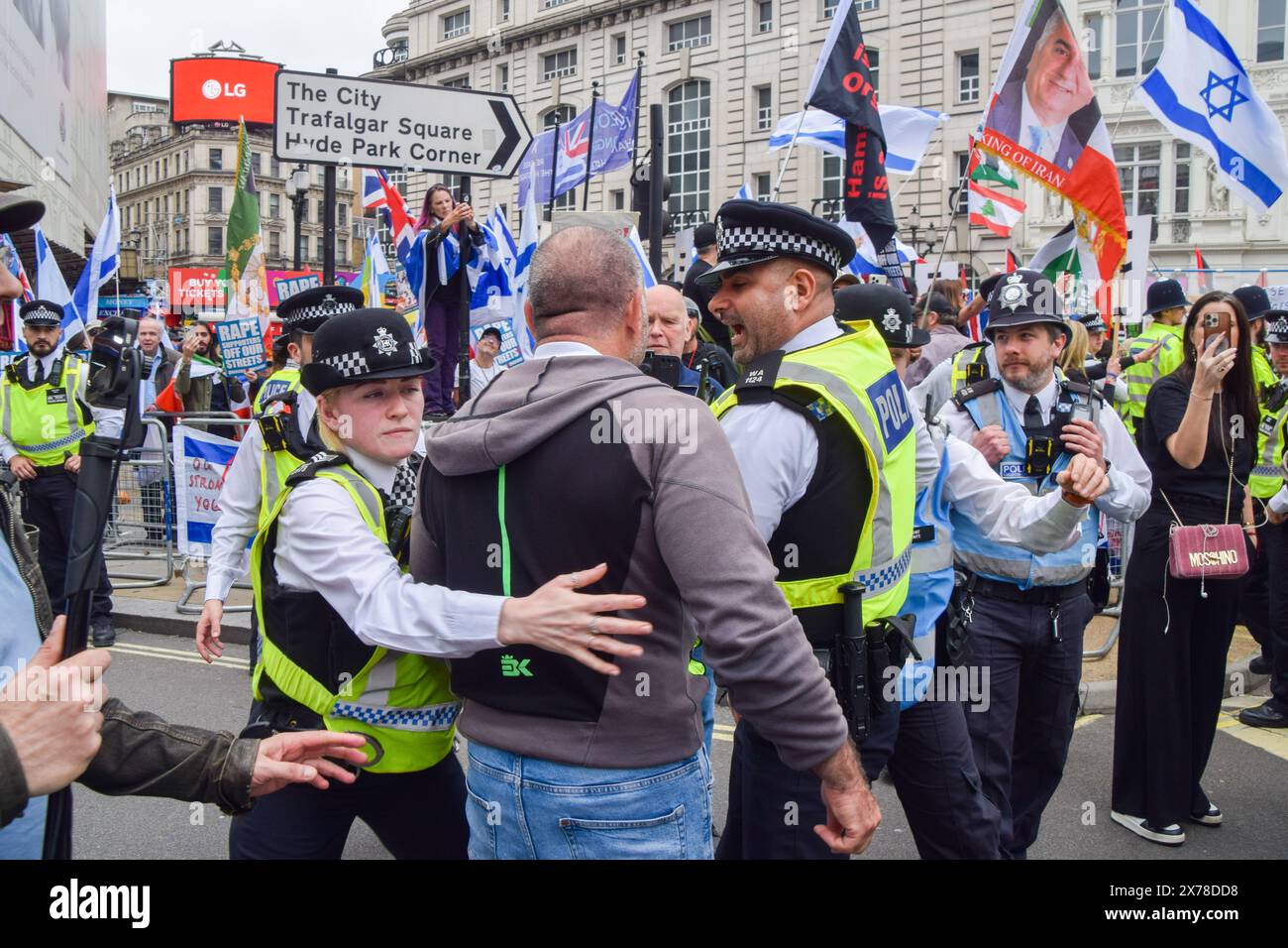 London, UK. 18th May 2024. Police officers arrest a protester in Piccadilly Circus. Thousands of people marched in solidarity with Palestine on the 76th anniversary of the Nakba, as Israel continues its attacks on Gaza. Credit: Vuk Valcic/Alamy Live News Stock Photo