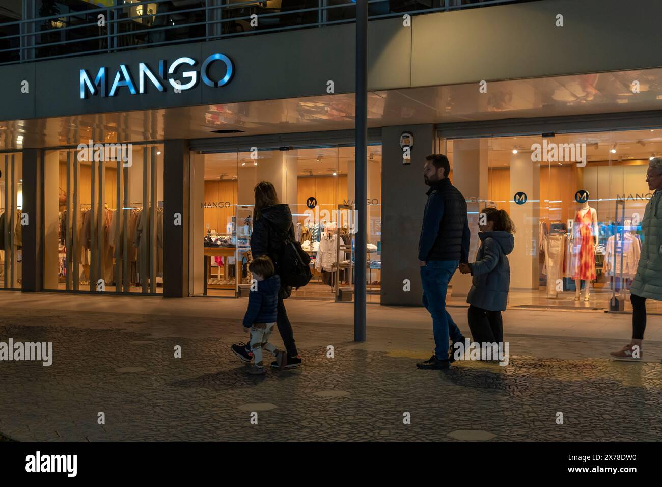 Cala Millor, Spain; march 30 2024: Main facade of a store of the Spanish international clothing and accessories chain Mango, at night Stock Photo