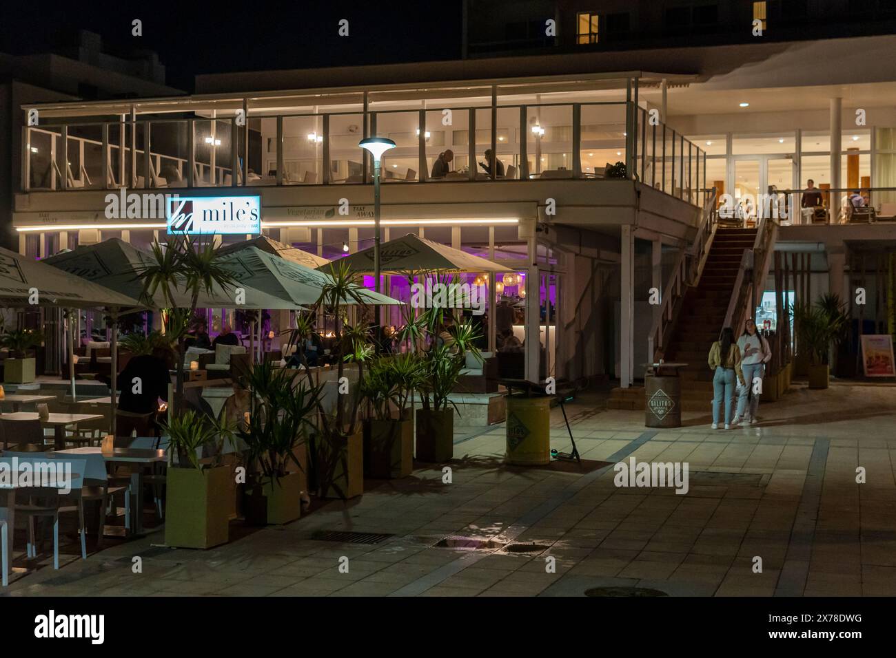 Cala Millor, Spain; march 30 2024: Main facade of a restaurant in the Majorcan town of Cala Millor, at night Stock Photo