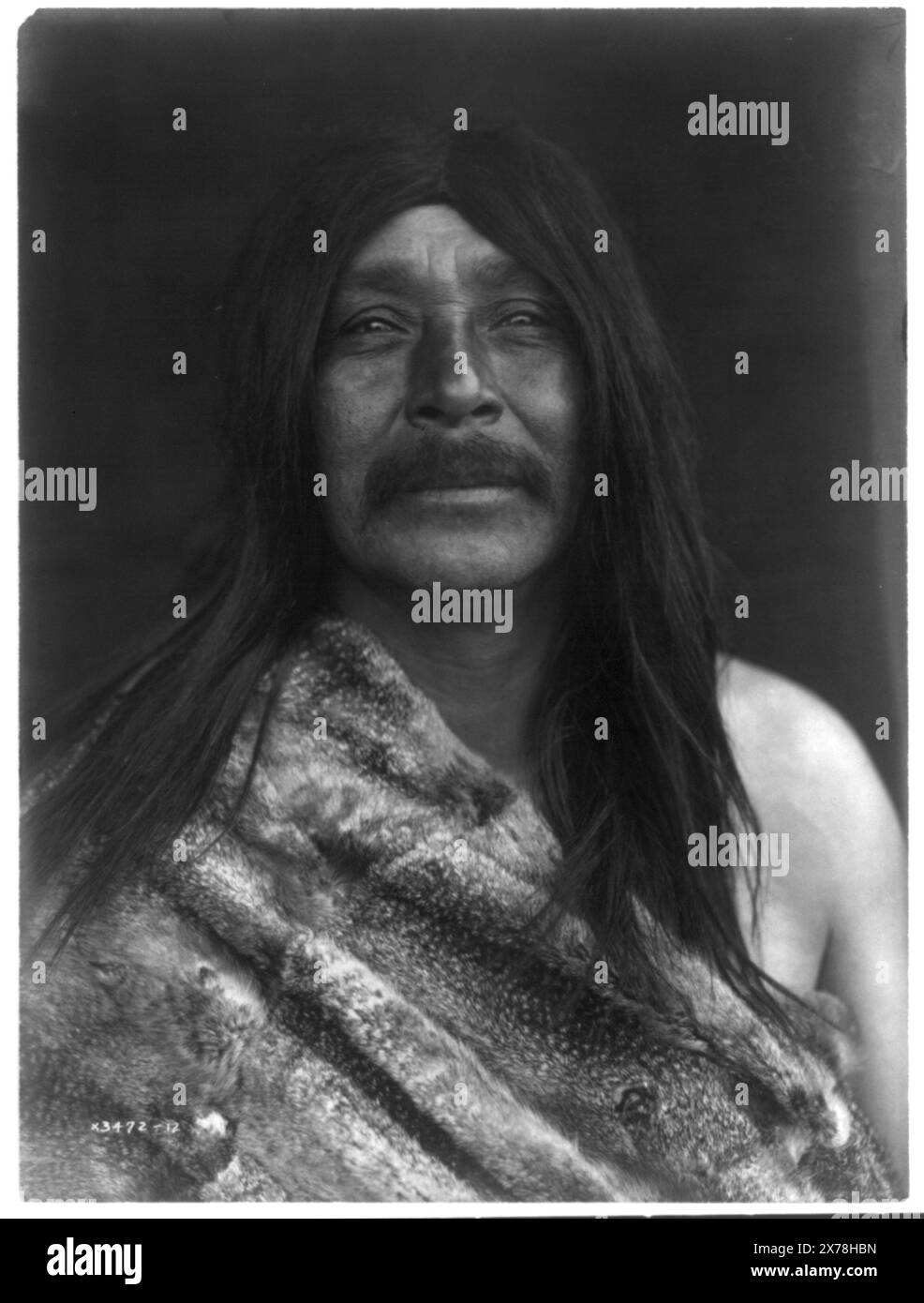 Lelehalt Quilcene, Curtis no. 3472-12., Forms part of: Edward S. Curtis Collection ., Published in: The North American Indian / Edward S. Curtis. [Seattle, Wash.] : Edward S. Curtis, 1907-30, Suppl. v. 9, pl. 304.. Lelehalt. , Indians of North America, 1910-1920. , Twana Indians, 1910-1920. , Hair, 1910-1920. Stock Photo