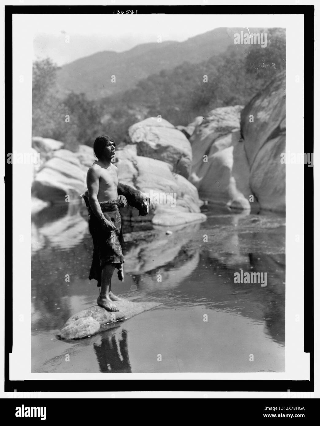 Quiet waters Tule River Reservation Yokuts, Title from item., Curtis no. 3959., Forms part of: Edward S. Curtis Collection ., Published in: The North American Indian / Edward S. Curtis. [Seattle, Wash.] : Edward S. Curtis, 1907-30, Suppl. v. 14, pl. 506.. Indians of North America, 1920-1930. , Yokuts Indians, 1920-1930. Stock Photo