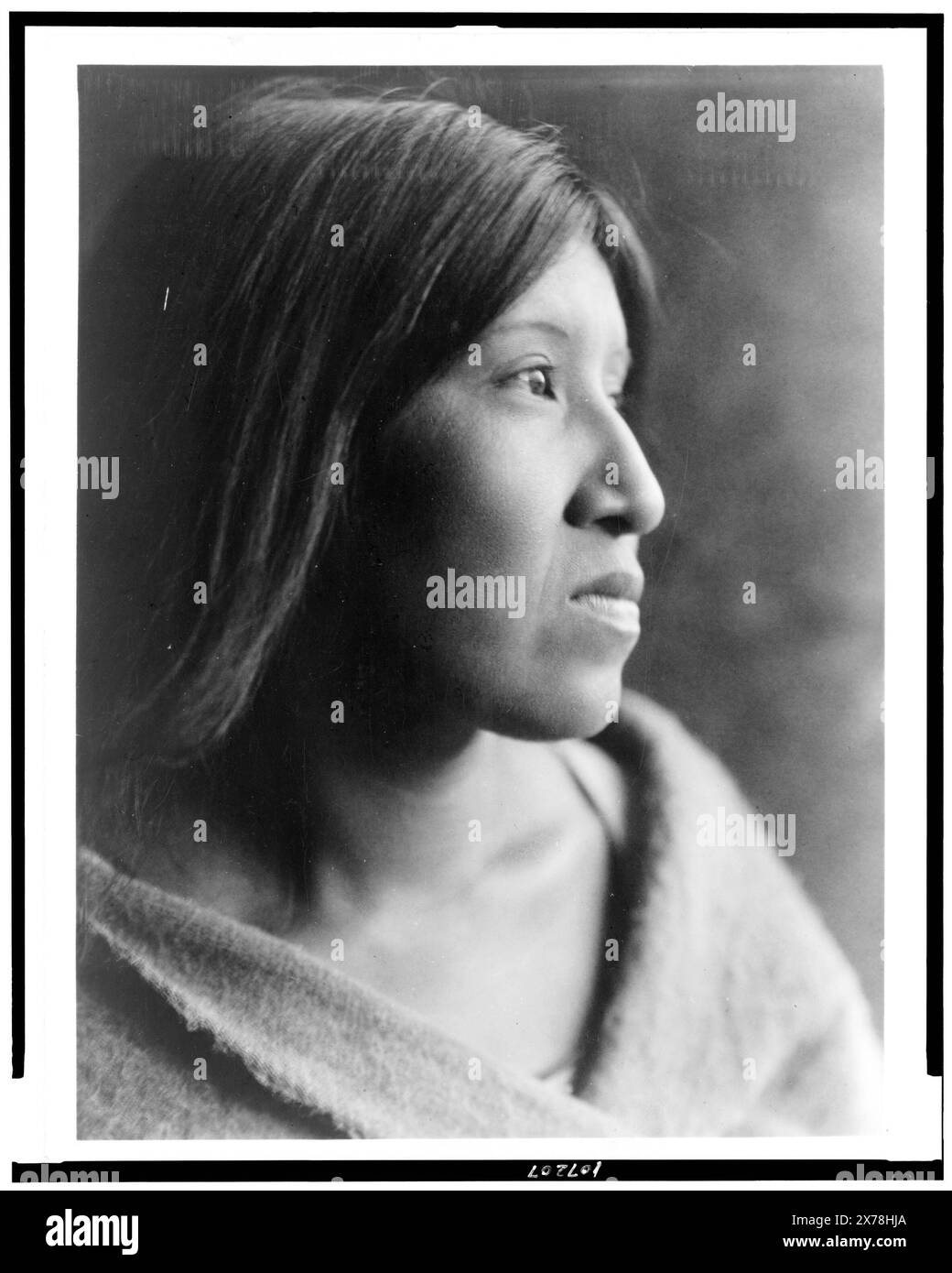 A Desert Cahuilla woman, head-and-shoulders portrait, facing right, Edward S. Curtis Collection., Curtis no. 4154., Published in: The North American Indian / Edward S. Curtis. [Seattle, Wash.] : Edward S. Curtis, 1907-30 Suppl., v. 15, pl. 522.. Indians of North America, Women, 1920-1930. , Cahuilla Indians, Women, 1920-1930. Stock Photo