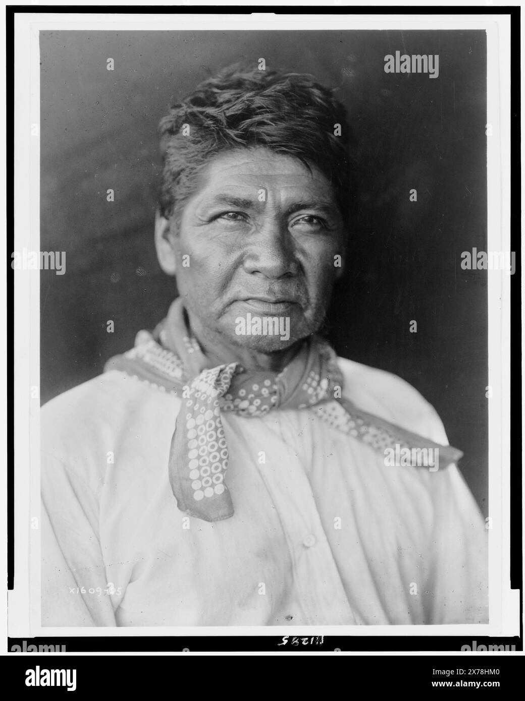 Marcos, Palm Cañon Cahuilla, half-length portrait, facing slightly right, Edward S. Curtis Collection., Curtis no. 1609-05., Published in: The North American Indian / Edward S. Curtis. [Seattle, Wash.] : Edward S. Curtis, 1907-30, suppl., v. 15, pl. 517.. Indians of North America, 1900-1910. , Cahuilla Indians, 1900-1910. Stock Photo