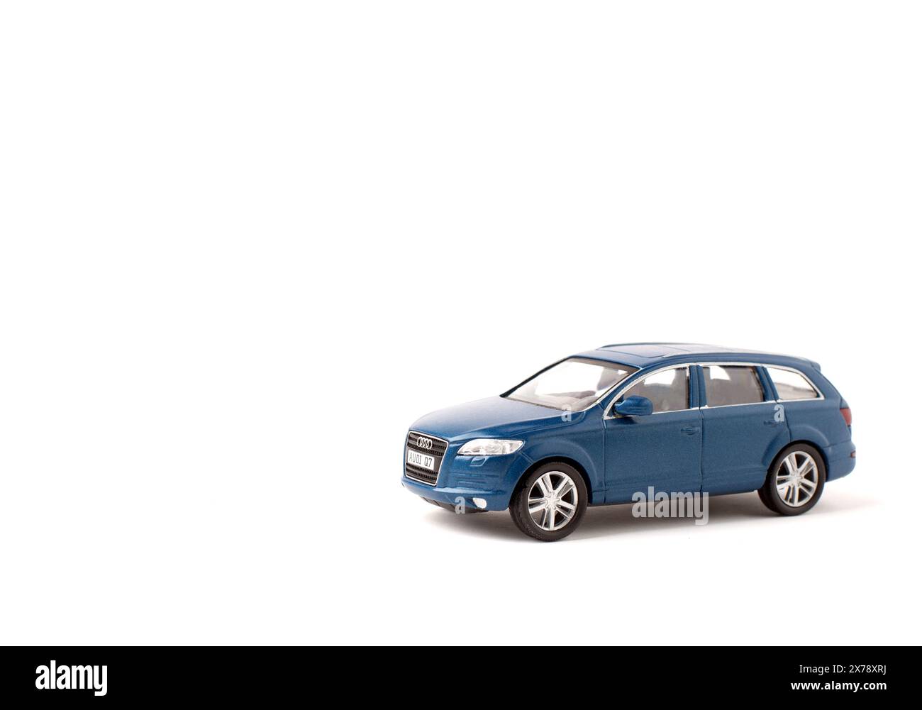 Blue iron toy car Audi q7 on a white background. SUV. copy space. sport utility vehicle. Stock Photo