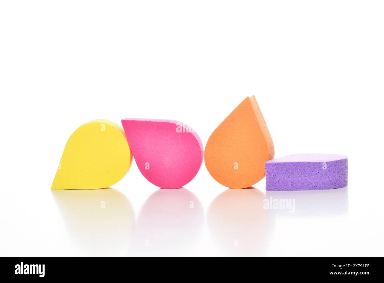 Colorful cosmetic makeup applicator sponge set isolated on white background. Stock Photo