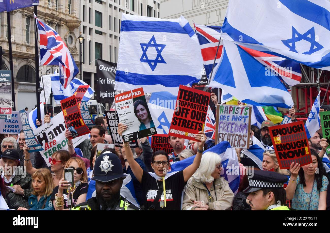 London, UK. 18th May, 2024. Pro-Israel supporters holding Israeli flags and anti-terror placards stage a counter-protest in Piccadilly Circus. Thousands of people marched in solidarity with Palestine on the 76th anniversary of the Nakba as Israel continues its attacks on Gaza. Credit: SOPA Images Limited/Alamy Live News Stock Photo