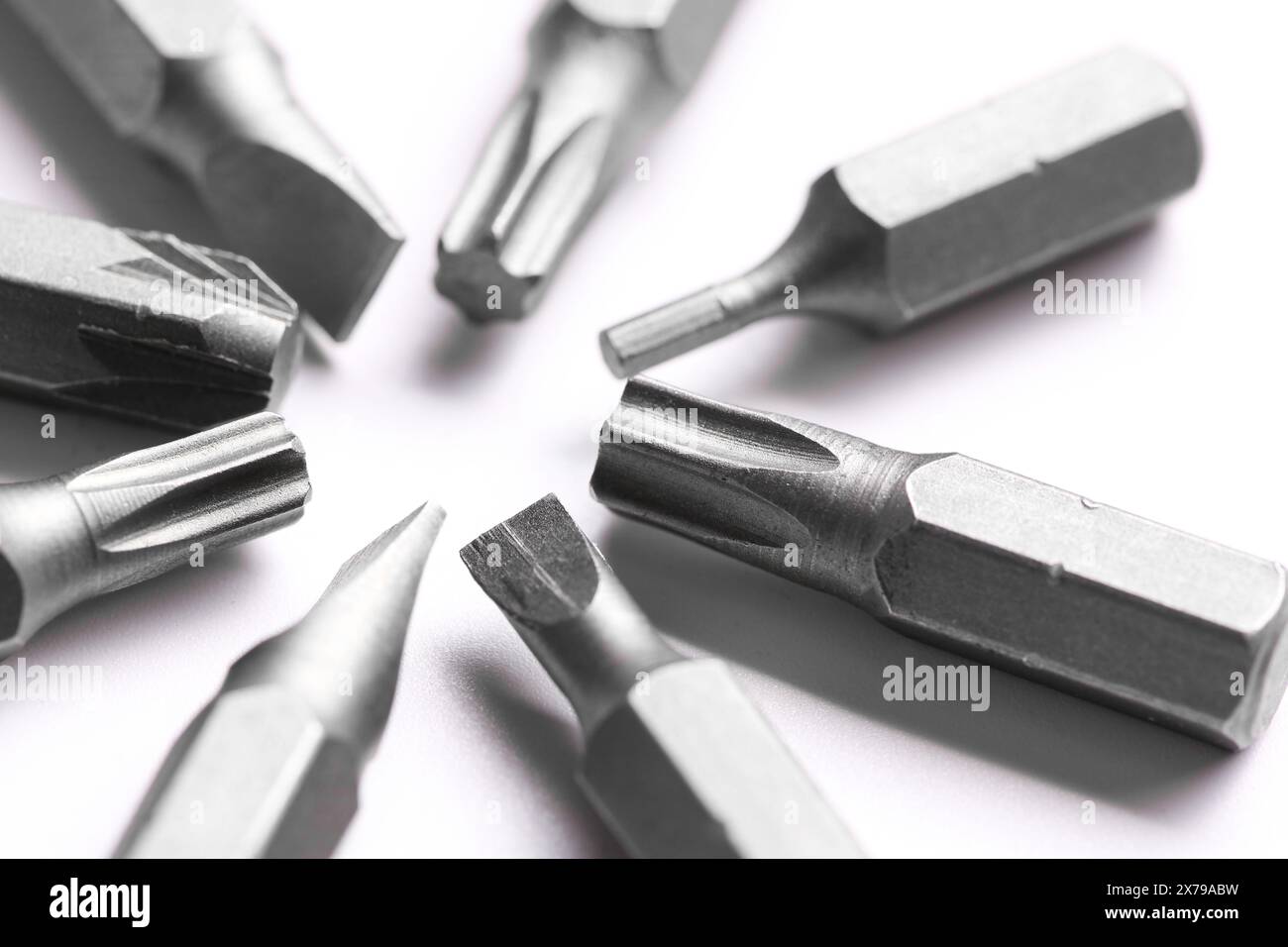 Different screwdriver bits on white background, closeup Stock Photo
