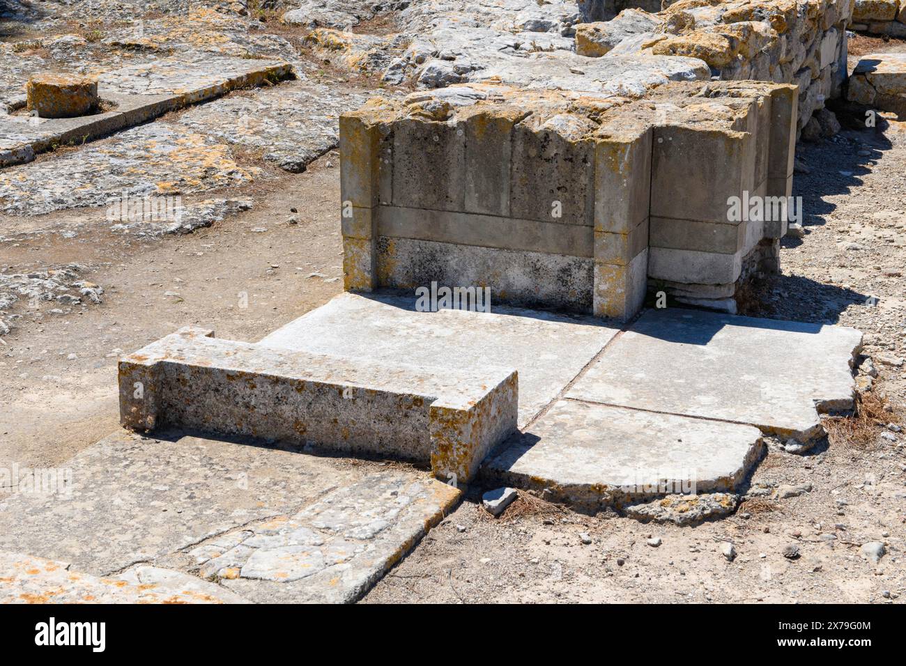 Detail of foundation walls of door Tor tor passage in building Komlpex with chambers of princess In excavation site on hill of Phaistos of Minoan Stock Photo