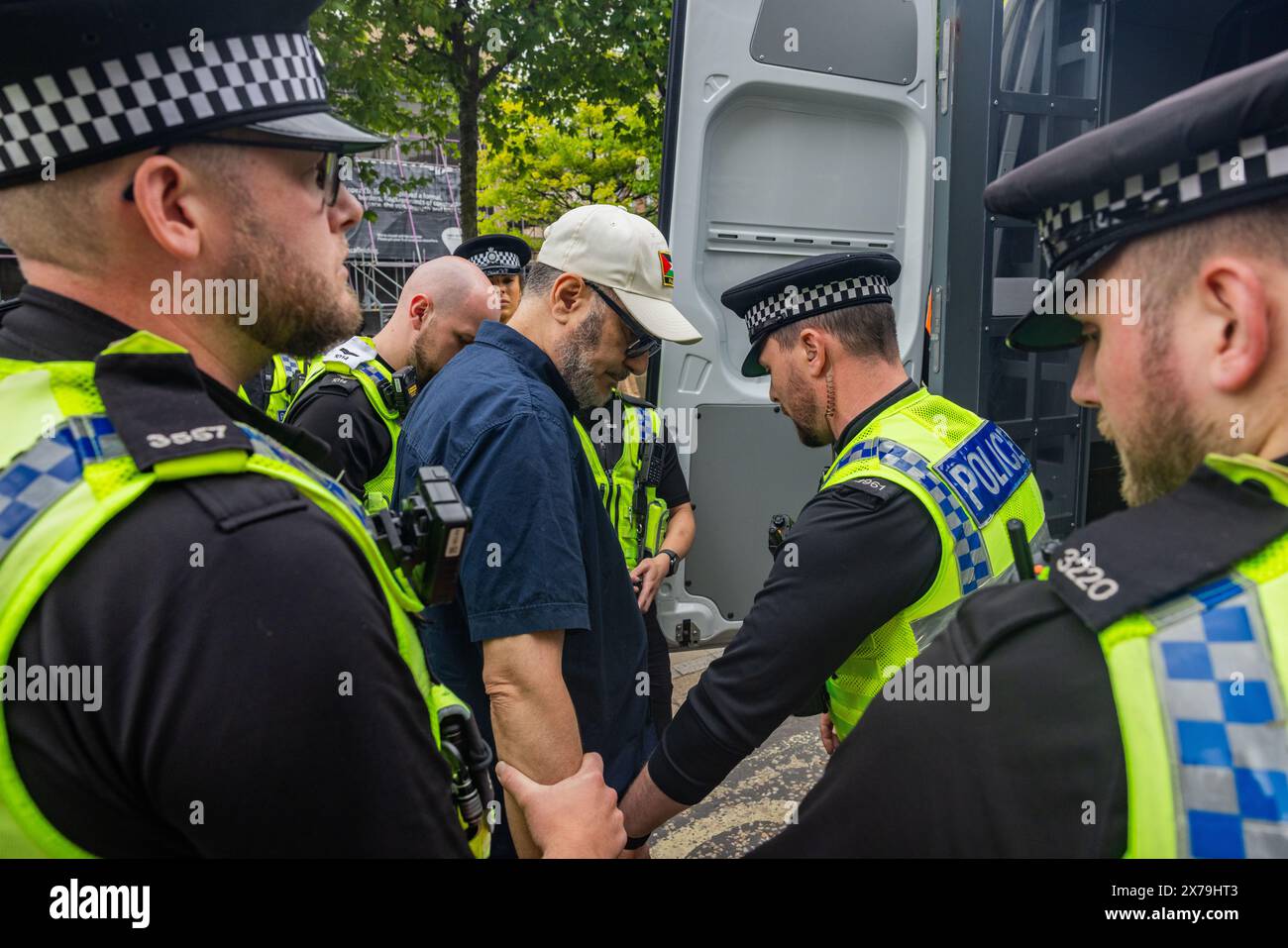 Leeds, UK. 18 MAY, 2024. Pro Palestine protestor is arrested outside Leeds art gallery at beginning of Leeds PSC March. It is understood that the individual was arrested, for a public order offence regarding a speech made at the 11.05.24 march.   They were taken via police van into custody at Elland Road police station. Time of arrest around 1.20 PM on 18.05.24. Credit Milo Chandler/Alamy Live News Stock Photo