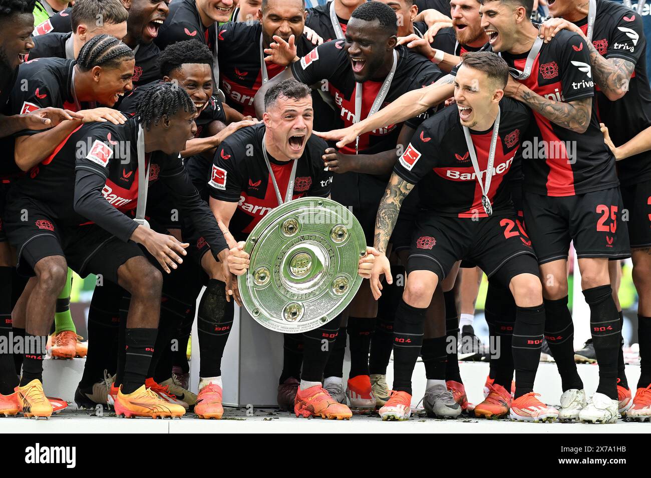 Leverkusen, Germany. 18th May, 2024. Granit Xhaka (C, front) of Bayer ...