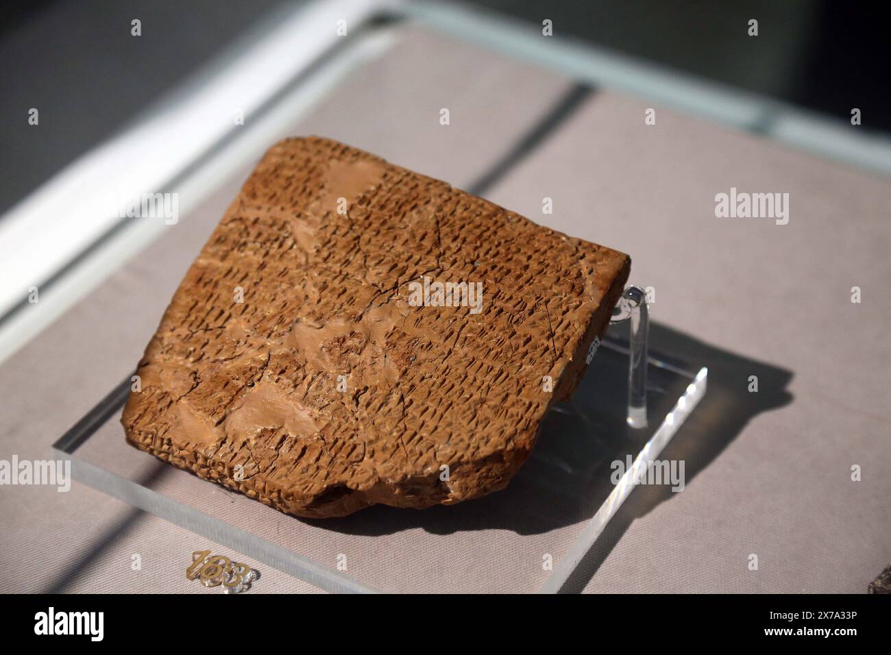 Tehran. 18th May, 2024. This photo taken on May 18, 2024 shows an ancient clay tablet at National Museum of Iran in Tehran, Iran. Iran on Saturday unveiled a selection of ancient clay tablets brought back to the country last year from the United States.TO GO WITH 'Iran unveils selection of ancient clay tablets returned from U.S.' Credit: Shadati/Xinhua/Alamy Live News Stock Photo