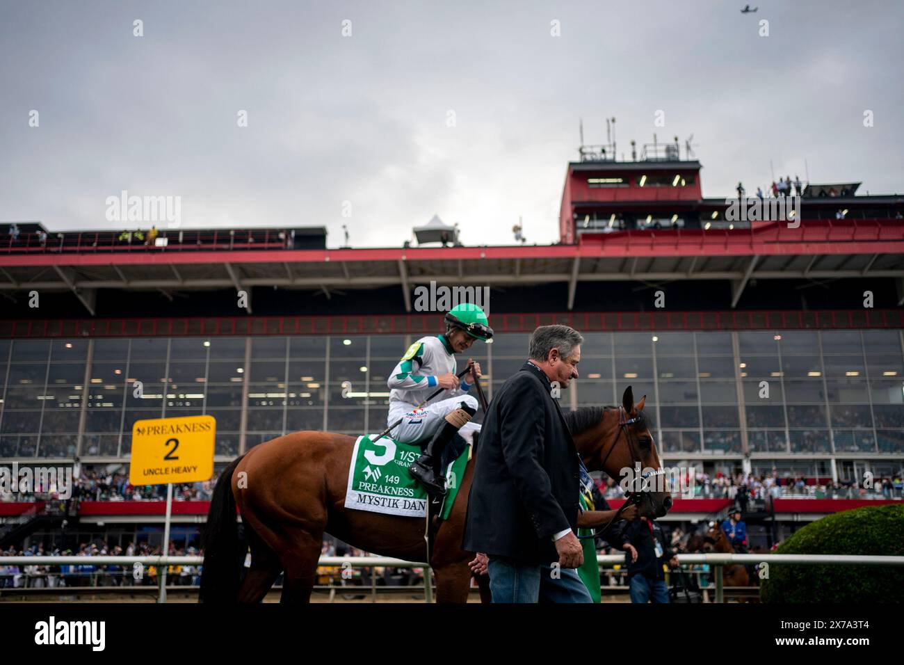Kentucky Derby winner Mystik Dan walks to the starting gate before the