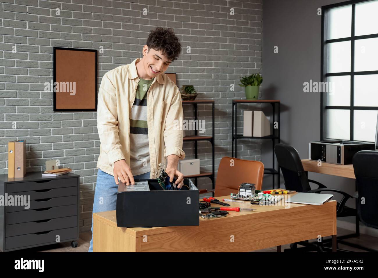 Smiling pc engineer repairing hi-res stock photography and images - Alamy