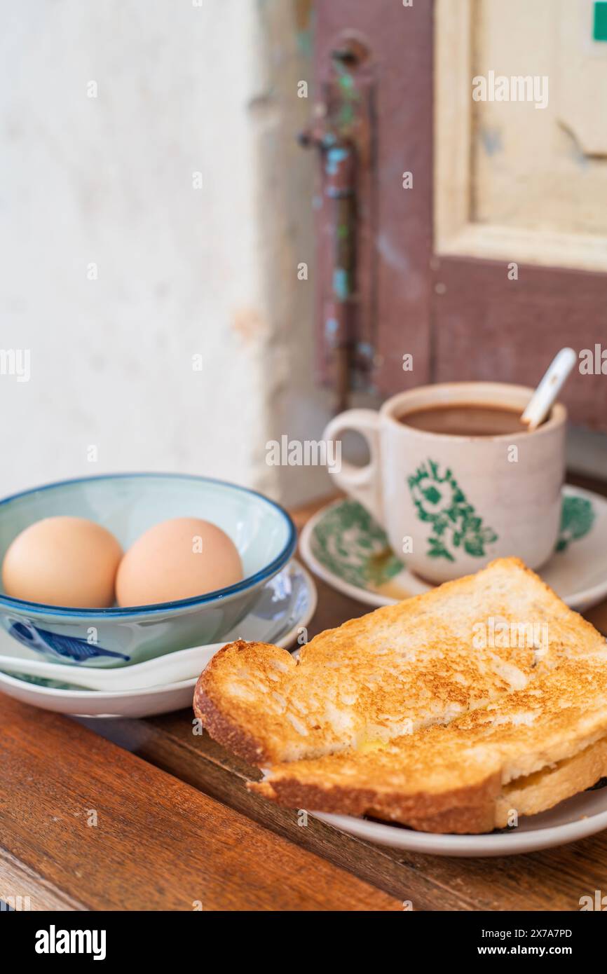 Traditional oriental Chinese kopitiam style in Melaca Malysia eggs bread and coffee Stock Photo