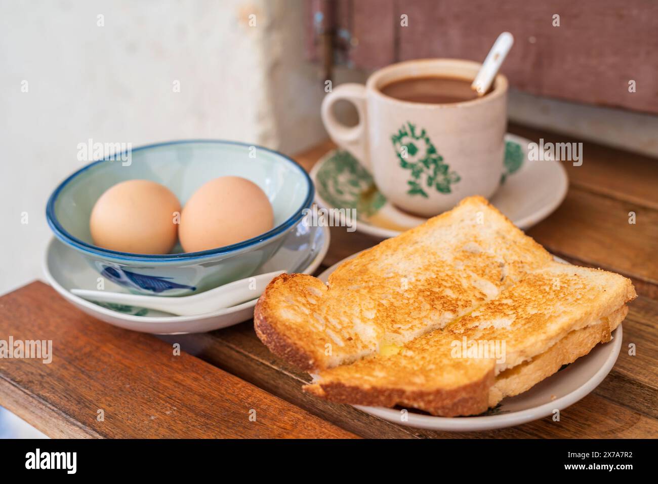 Traditional oriental Chinese kopitiam style in Melaca Malysia eggs bread and coffee Stock Photo