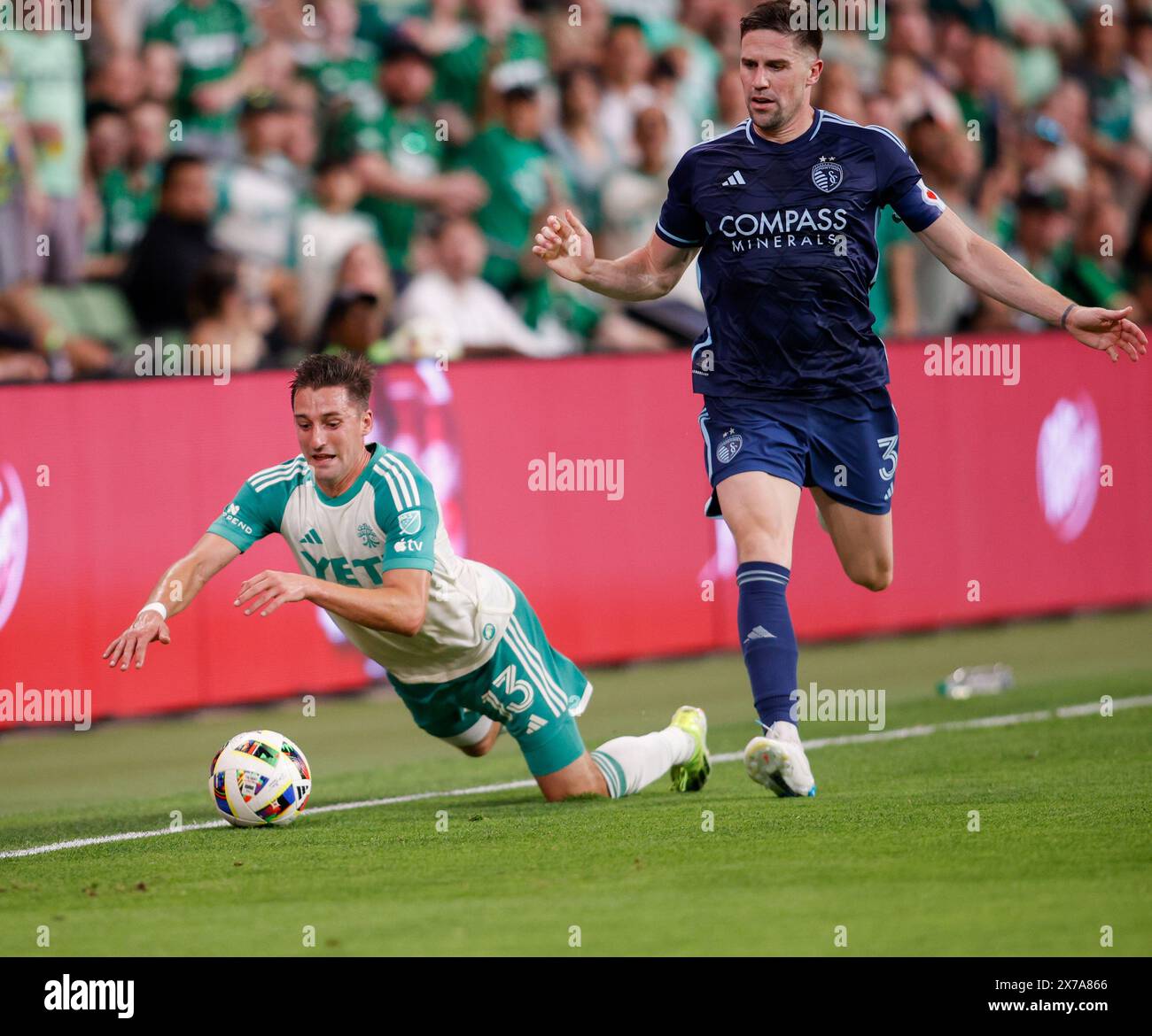 Austin, Texas, USA. 18th May, 2024. Austin FC midfielder Ethan Finlay (13) goes down after getting a push from Sporting Kansas City defender Andreu FontÃ s (3) during a Major League Soccer match on May 18, 2024 in Austin. Austin won, 3-2. (Credit Image: © Scott Coleman/ZUMA Press Wire) EDITORIAL USAGE ONLY! Not for Commercial USAGE! Stock Photo