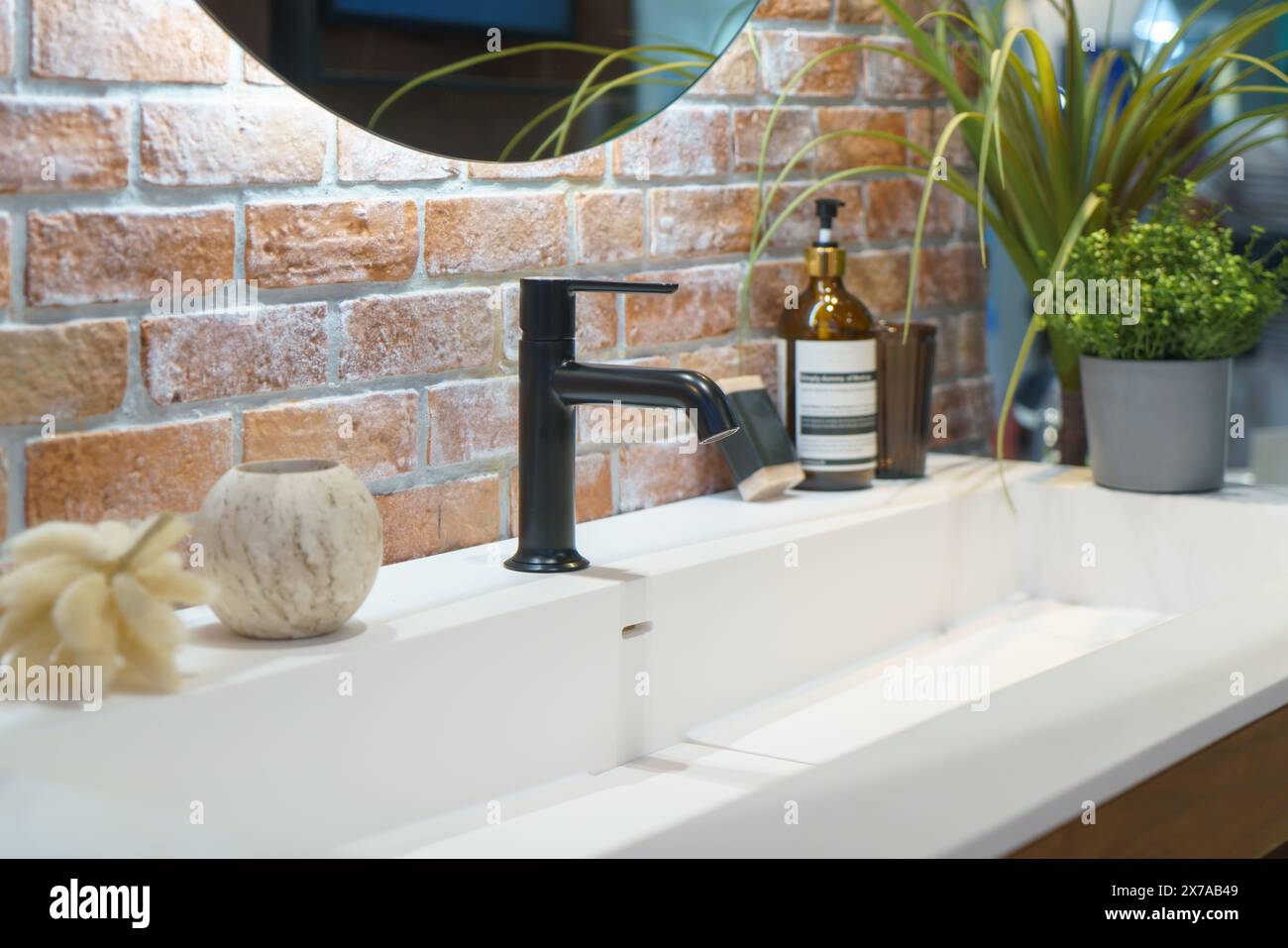 Modern faucet featuring a minimalist design and premium finish, it combines functionality with style Stock Photo