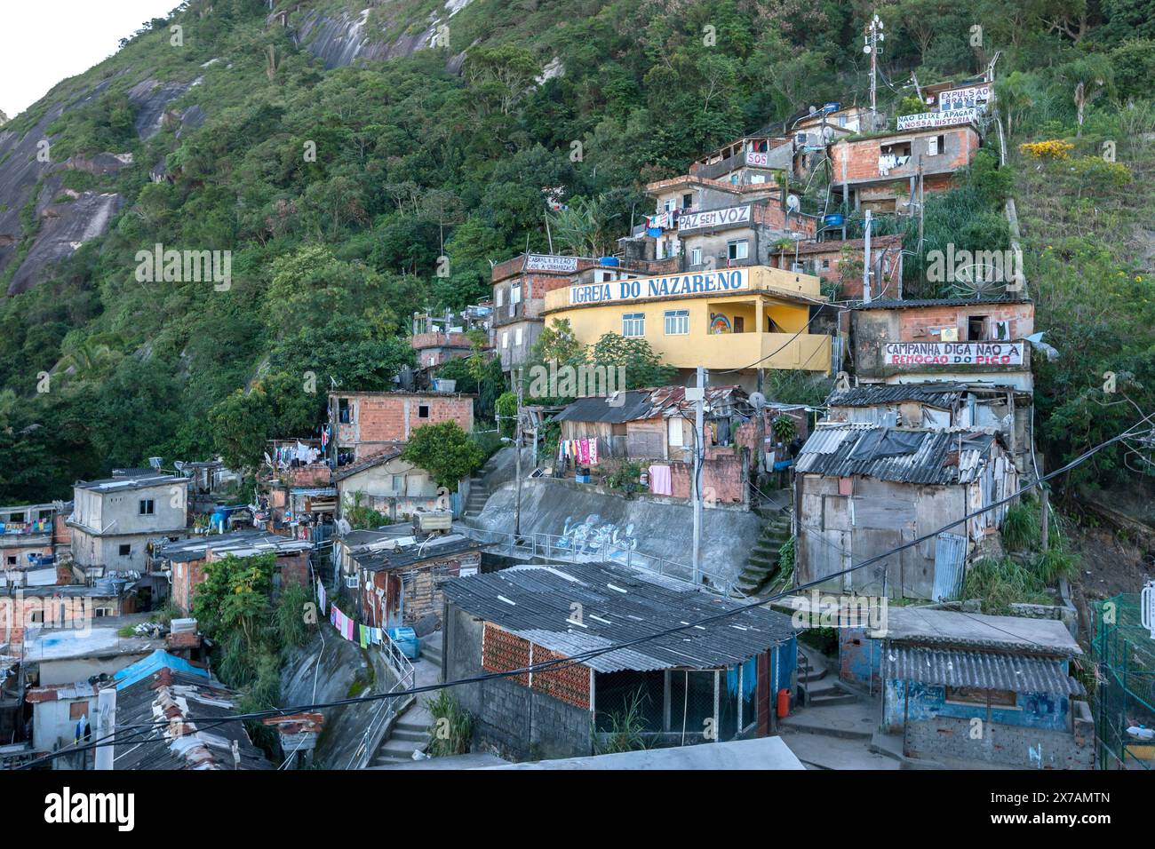 Homes In Rio Homes cling to the side of a steep mountain in the Santa Marta favela ...