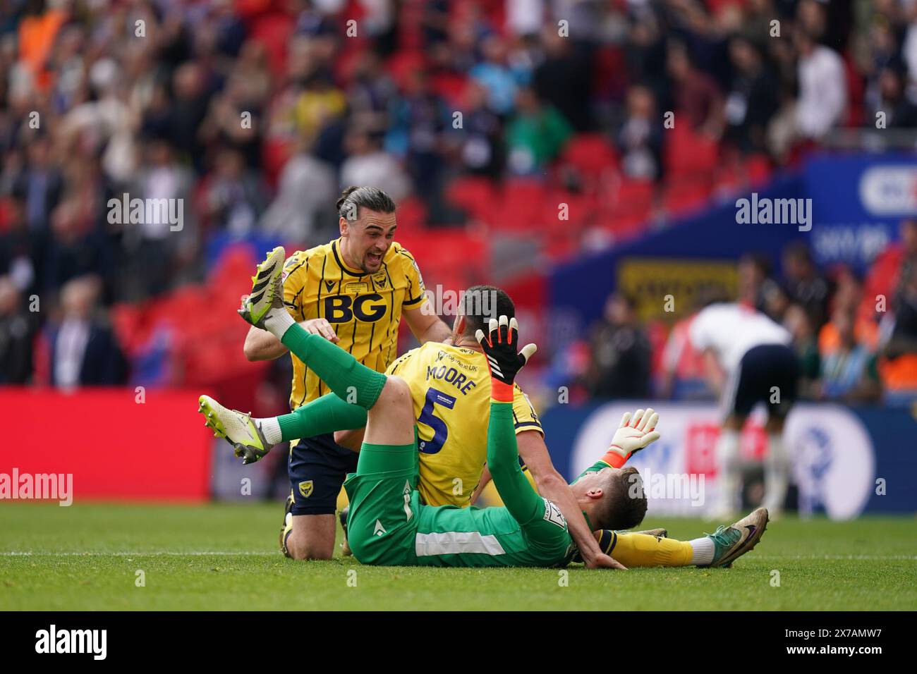 LONDON, ENGLAND - MAY 18: Jamie Cumming of Oxford United, Ciaron Brown of Oxford United and Elliott Moore of Oxford United celebrating the victory after the Sky Bet League One Play-Off Final match between Bolton Wanderers and Oxford United at Wembley Stadium on May 18, 2024 in London, England.(Photo by Dylan Hepworth/MB Media) Stock Photo