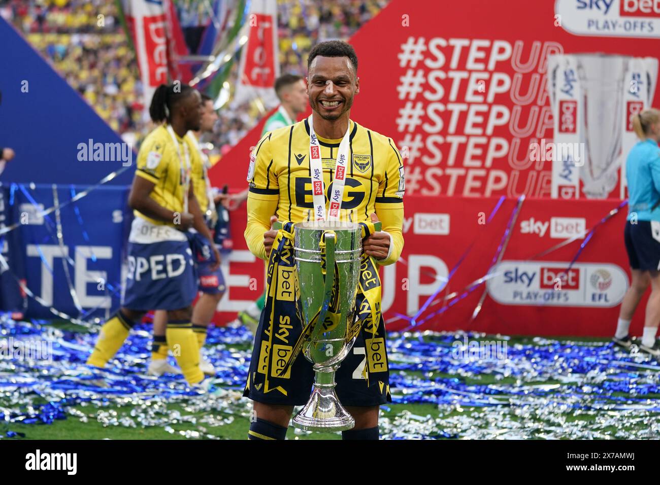 LONDON, ENGLAND - MAY 18: Josh Murphy of Oxford United with the League One play off final Trophy after the Sky Bet League One Play-Off Final match between Bolton Wanderers and Oxford United at Wembley Stadium on May 18, 2024 in London, England.(Photo by Dylan Hepworth/MB Media) Stock Photo